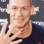 John Cena holding up five fingers